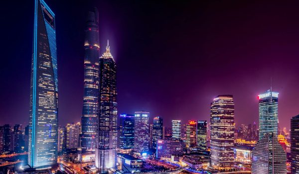 Majestic view of Shanghai's illuminated skyline featuring iconic skyscrapers at night.